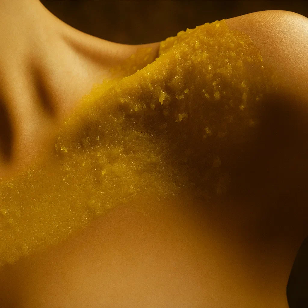 Close-up of a person with a yellow scrub on their upper body
